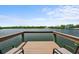 Enjoy waterfront relaxation with a private wooden dock and comfortable seating with scenic views at 10432 Sandpiper W Rd, Bradenton, FL 34209