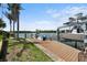 Beautiful waterfront home featuring a private wooden dock for easy boat access and enjoyment at 10432 Sandpiper W Rd, Bradenton, FL 34209