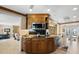 Bright kitchen with granite countertops, wooden cabinetry, and modern appliances with an eat-in nook at 10432 Sandpiper W Rd, Bradenton, FL 34209