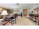 Spacious living room featuring tile flooring, stylish decor, and an open layout connecting to other living spaces at 10432 Sandpiper W Rd, Bradenton, FL 34209