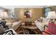Cozy living room with comfortable sofas, decorative rug, and neutral wall color, perfect for relaxing at 10432 Sandpiper W Rd, Bradenton, FL 34209