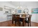 Stylish dining room with modern chandelier and decor, next to an open kitchen at 1052 32Nd St, Sarasota, FL 34234