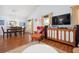 Living area with dining area view, featuring stylish furnishings and hardwood floors at 1052 32Nd St, Sarasota, FL 34234