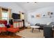 Bright and airy living room with modern decor, vaulted ceiling, and hardwood flooring at 1052 32Nd St, Sarasota, FL 34234