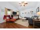 Inviting living room with TV, vaulted ceilings, hardwood floors, and comfortable seating at 1052 32Nd St, Sarasota, FL 34234