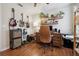 Bright home office featuring guitar display, hardwood floors, and stylish furnishings at 1052 32Nd St, Sarasota, FL 34234