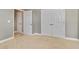 Bedroom featuring neutral carpet and baseboards, closet, and white doors at 1109 Riverscape St, Bradenton, FL 34208