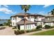 Beautiful two-story home featuring a tile roof, light stucco, two-car garage, and well-maintained landscaping at 1109 Riverscape St, Bradenton, FL 34208