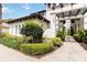Beautifully landscaped front corner with brick pathway leading to the home's entrance at 1109 Riverscape St, Bradenton, FL 34208