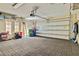 Spacious two-car garage with brick floors, garage door opener, and ample storage space at 1109 Riverscape St, Bradenton, FL 34208