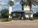 Gated entrance to community with brick-paved road, lush landscaping, and guard house at 1109 Riverscape St, Bradenton, FL 34208