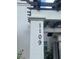 Close-up of house number 1109 attached to a pillar with decorative wood at 1109 Riverscape St, Bradenton, FL 34208