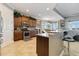 Spacious kitchen featuring granite countertops, stainless steel appliances, and wood cabinetry at 1109 Riverscape St, Bradenton, FL 34208