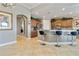 Spacious kitchen with breakfast bar, stainless appliances and decorative molding at 1109 Riverscape St, Bradenton, FL 34208