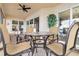 This screened lanai features a round dining table with seating and access to indoor living spaces at 1109 Riverscape St, Bradenton, FL 34208
