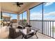 This screened lanai features comfortable seating and beautiful water views, perfect for relaxing outdoors at 1109 Riverscape St, Bradenton, FL 34208