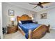 Comfortable primary bedroom with decorative headboard, side tables, and neutral walls for a serene retreat at 1109 Riverscape St, Bradenton, FL 34208