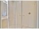 Modern shower stall with glass enclosure and neutral tilework for a spa-like experience at 1109 Riverscape St, Bradenton, FL 34208