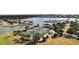 Community tennis courts overlooking the serene water and boat docks with well-maintained landscaping at 1109 Riverscape St, Bradenton, FL 34208