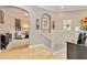 Open upstairs landing with tile flooring and decorative accents, with living space in view at 1109 Riverscape St, Bradenton, FL 34208
