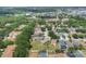 An aerial view displays a residential community with green spaces, tree coverage and houses at 11236 Beebalm Cir, Lakewood Ranch, FL 34202
