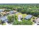 Overhead view capturing homes with fenced yards and lush tree coverage in the area at 11236 Beebalm Cir, Lakewood Ranch, FL 34202