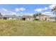 Spacious backyard with lush grass, and homes with sliding glass doors at 11236 Beebalm Cir, Lakewood Ranch, FL 34202