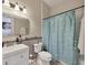 Stylish bathroom featuring a toilet, sink, and relaxing shower at 11236 Beebalm Cir, Lakewood Ranch, FL 34202