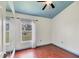 Spare bedroom with hardwood floors, blue trim, and a window view at 11236 Beebalm Cir, Lakewood Ranch, FL 34202