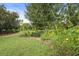 A relaxing spot in the community park with a swing set, bench and flowering plants at 11236 Beebalm Cir, Lakewood Ranch, FL 34202