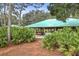 Covered community pavilion with picnic tables and grills, surrounded by lush landscaping at 11236 Beebalm Cir, Lakewood Ranch, FL 34202
