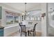 Cozy dining area features natural light and a decorative chandelier at 11236 Beebalm Cir, Lakewood Ranch, FL 34202