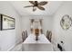 Cozy dining room featuring a large window, a ceiling fan, and view to the dining table at 11236 Beebalm Cir, Lakewood Ranch, FL 34202