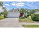 Charming home featuring well-manicured lawn, mature landscaping, and a welcoming entrance at 11236 Beebalm Cir, Lakewood Ranch, FL 34202