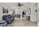 Open living space with modern flooring and access to the kitchen, perfect for entertaining at 11236 Beebalm Cir, Lakewood Ranch, FL 34202