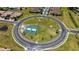 Aerial view of community showing roundabout, pickleball courts, and surrounding homes at 1203 Calle Grand St, Bradenton, FL 34209