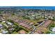 Breathtaking aerial view of a neighborhood with lush greenery, water features, and stunning waterfront property at 1203 Calle Grand St, Bradenton, FL 34209