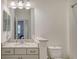 Bathroom featuring a granite vanity, a mirror and a shower at 1203 Calle Grand St, Bradenton, FL 34209