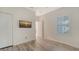 Bedroom showcasing wood-look flooring, a ceiling fan, and a window with blinds at 1203 Calle Grand St, Bradenton, FL 34209