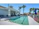 Inviting community pool with shaded seating areas and lush landscaping at 1203 Calle Grand St, Bradenton, FL 34209