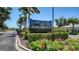 Elegant Mirabella community sign with lush landscaping and a glimpse of homes at 1203 Calle Grand St, Bradenton, FL 34209