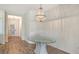 Dining area featuring modern chandelier and views of entry door and adjacent rooms at 1203 Calle Grand St, Bradenton, FL 34209
