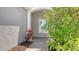 Inviting entryway featuring a neutral color palette and beautifully maintained landscaping that adds warmth and charm at 1203 Calle Grand St, Bradenton, FL 34209
