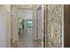 Elegant foyer featuring a decorative glass front door with chandelier and an open floor plan for seamless transitions at 1203 Calle Grand St, Bradenton, FL 34209