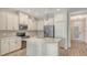 Bright kitchen featuring stainless appliances, white cabinets, granite countertops and backsplash at 1203 Calle Grand St, Bradenton, FL 34209