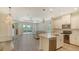 Open kitchen with granite countertops, stainless steel appliances, and seamless flow into the living area at 1203 Calle Grand St, Bradenton, FL 34209