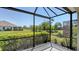 Secluded screened lanai providing stunning views of the community's lush landscaping and water features at 1203 Calle Grand St, Bradenton, FL 34209