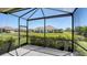 Screened in lanai overlooking the landscaped backyard at 1203 Calle Grand St, Bradenton, FL 34209