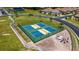 Two community pickleball courts surrounded by a fence and landscaping at 1203 Calle Grand St, Bradenton, FL 34209