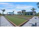 View of the bocce ball court with outdoor seating and the community building in the background at 12440 Wellen Golf St # 105, Venice, FL 34293